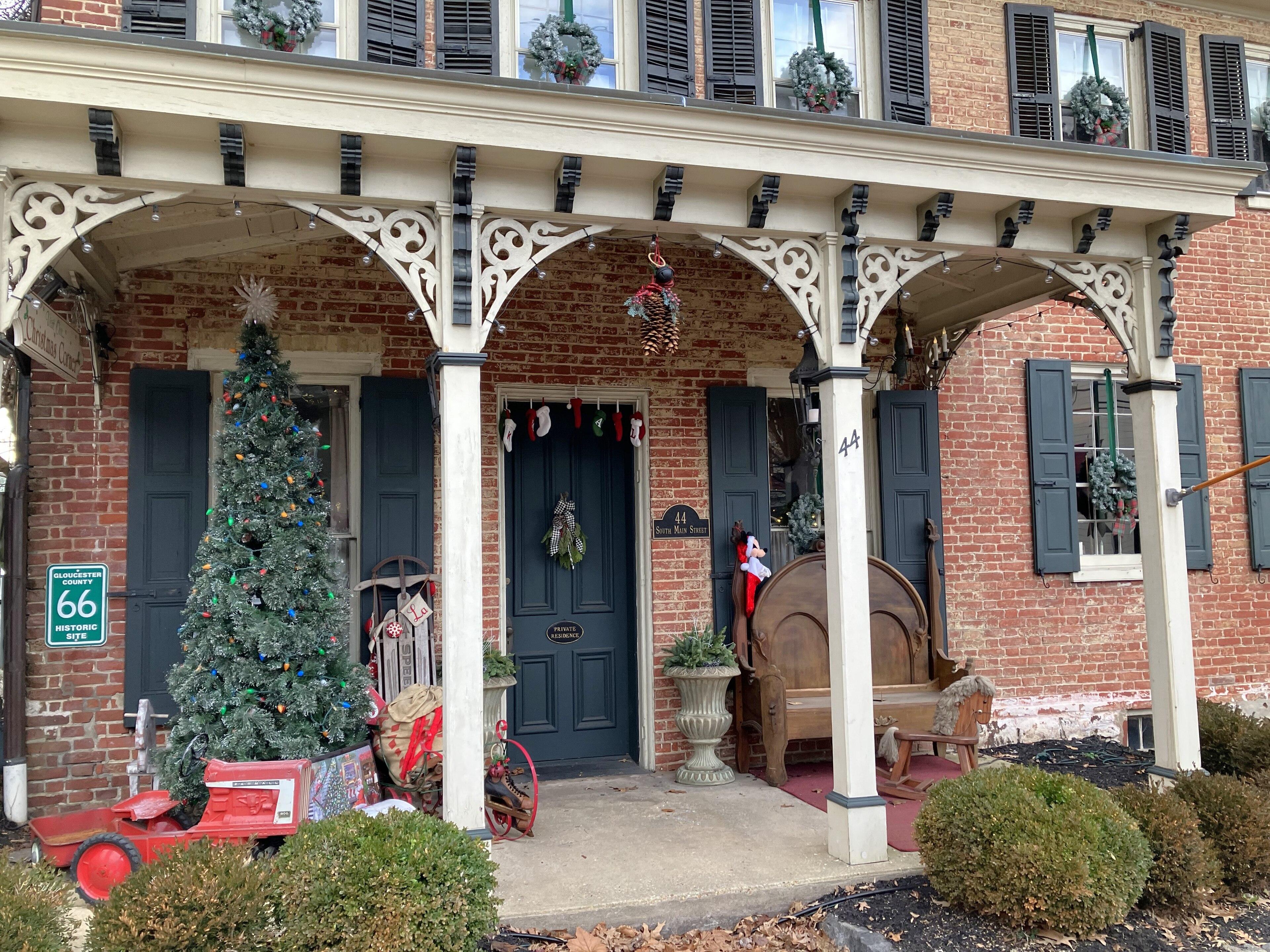 A Brick Row porch on Main Street decorated for Christmas